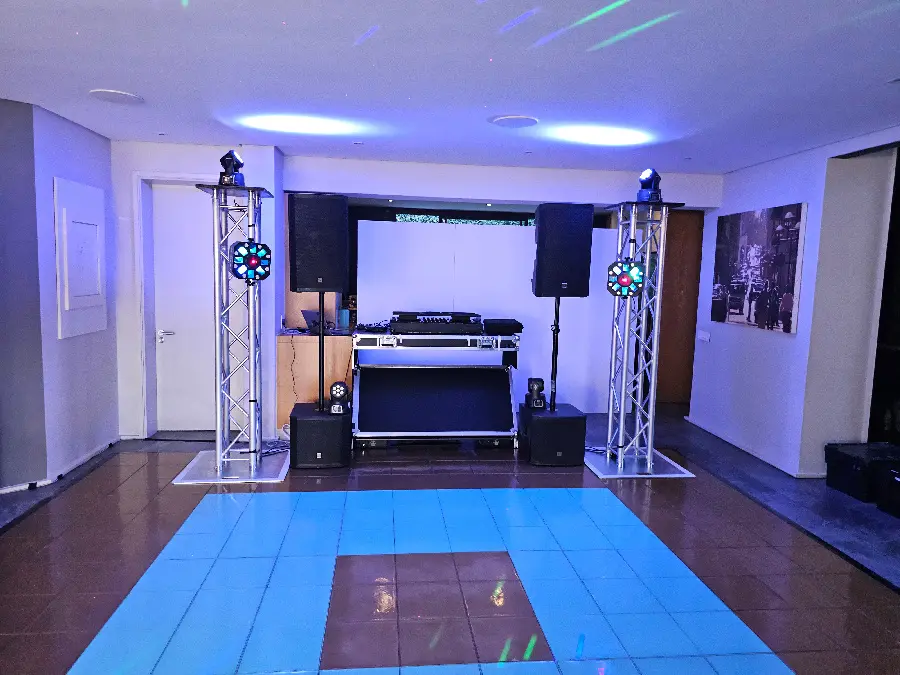 Professional audio and lighting setup with LED dance floor