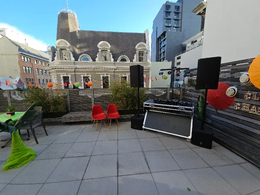 Outdoor rooftop audio equipment with Cape Town skyline